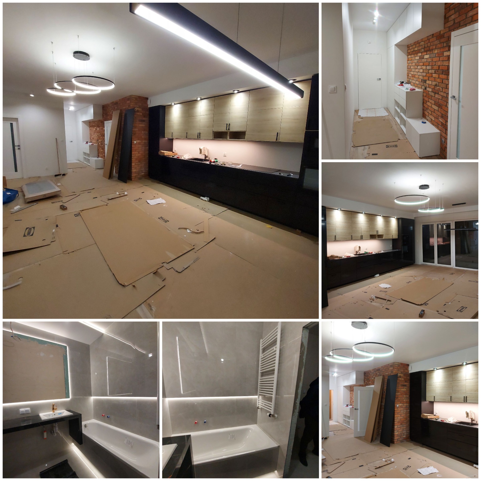Wnętrze mieszkania w trakcie prac wykończeniowych: kuchnia z zabudową meblową i wyspą, łazienka z wanną i umywalką, podłogi zabezpieczone kartonem, nowoczesne oświetlenie sufitowe.