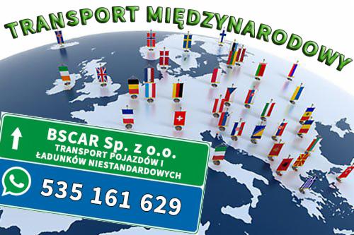 Grafika reklamowa firmy BSCAR Sp. z o.o. świadczącej usługi transportu pojazdów i ładunków niestandardowych na tle mapy świata z flagami różnych krajów i napisem 'Transport Międzynarodowy'...