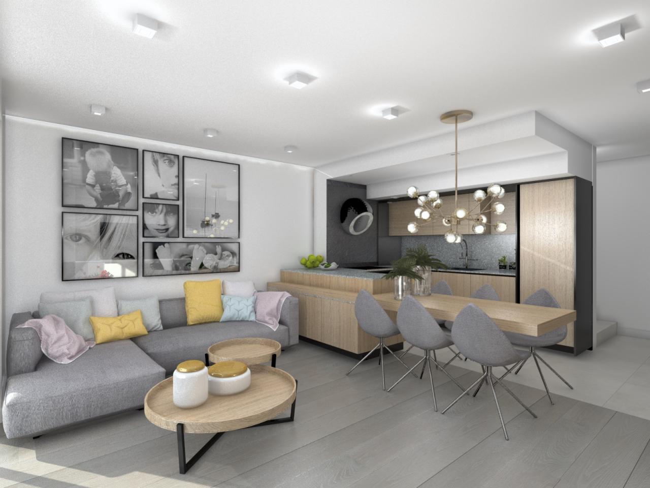 Wizualizacja wnętrza otwartego mieszkania z szarą sofą narożną, drewnianymi stolikami kawowymi, galerią czarno-białych zdjęć na ścianie, stołem jadalnym z szarymi krzesłami oraz aneksem kuchennym...