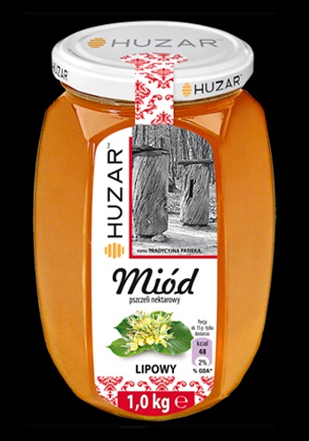 Słoik z lipowym nektarowym, z etykietą marki Huzar i grafiką uli w tle, zamknięty białą nakrętką z czerwonym wzorem.