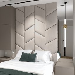 B-projekt - Nowoczesna sypialnia z tapicerowanym panelem zagłówkowym w geometryczny wzór, białą pościelą z zielonymi akcentami i minimalistycznym oświetleniem.