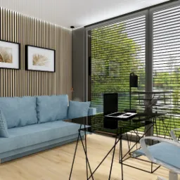 Stylowe biuro w domu z błękitną sofą, czarnym szklanym biurkiem i widokiem na zieleń przez okno z żaluzjami. Ściana z drewnianych paneli i grafiki.