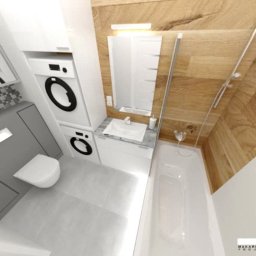 MAKAREWICZ Projekt - Wizualizacja małej łazienki z pralką i suszarką w zabudowie, drewnianą okładziną ściany i białą wanną.