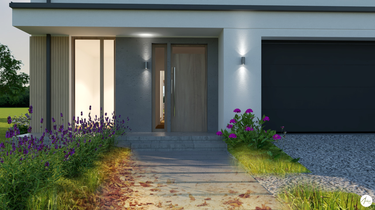 Nowoczesny dom z szarą bramą garażową i drewnianymi elementami elewacji, oświetlony lampami ściennymi, z nasadzeniami fioletowych i różowych kwiatów wzdłuż ścieżki prowadzącej do drzwi wejściowych.