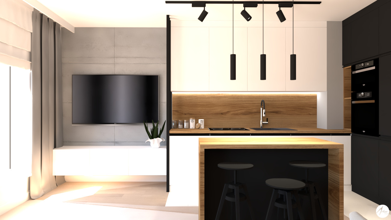 Nowoczesna kuchnia z wyspą, czarno-białymi szafkami i drewnianymi akcentami, oświetlona wiszącymi lampami i reflektorami, z telewizorem w tle.