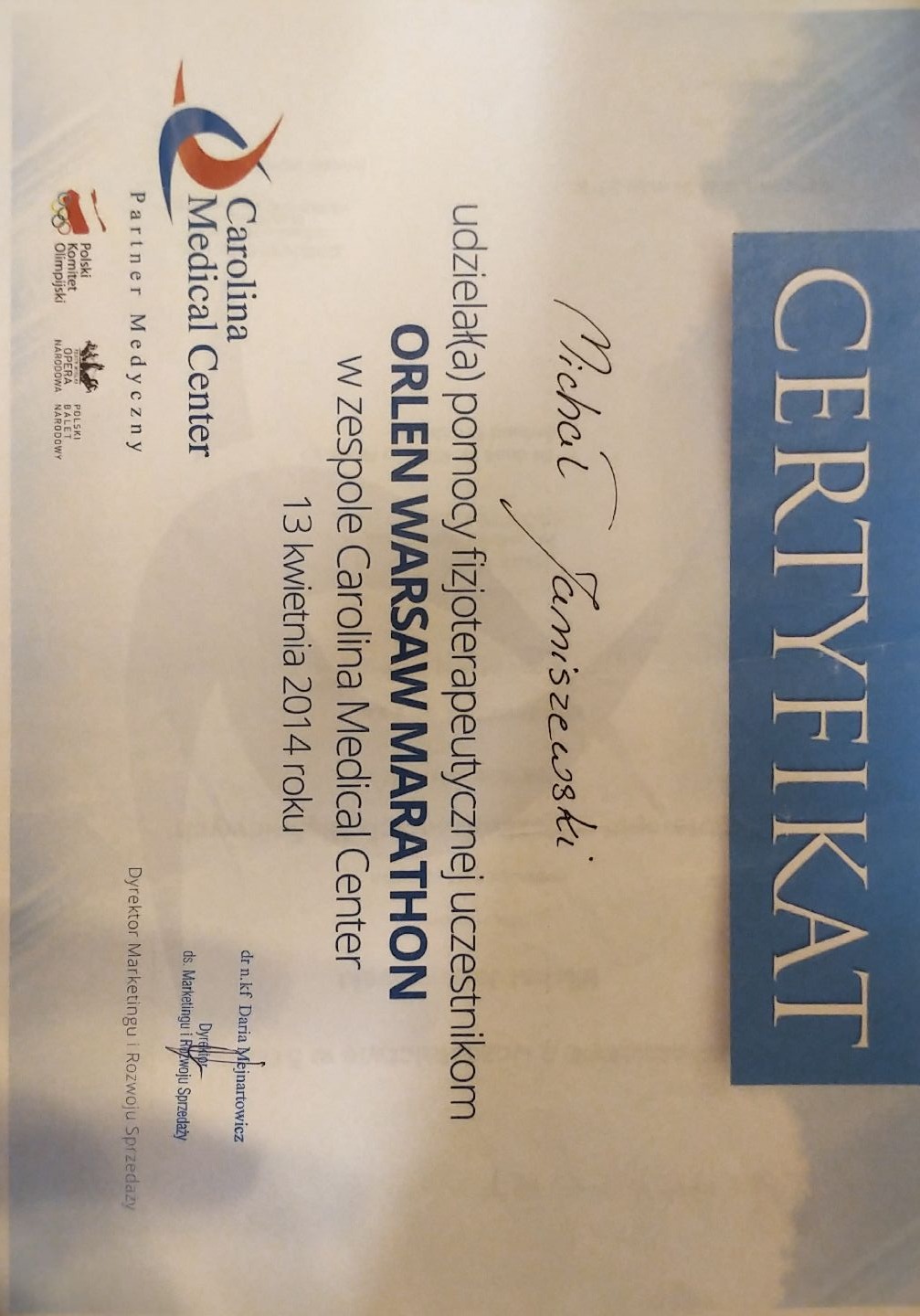 Certyfikat dla Michała Janiszewskiego za pomoc fizjoterapeutyczną podczas Orlen Warsaw Marathon w 2014 roku, wydany przez Carolina Medical Center.