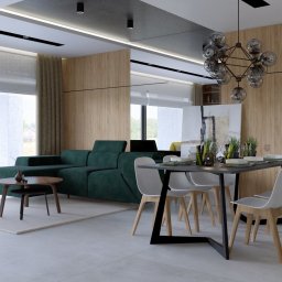Inspiration Studio - Wizualizacja salonu z zieloną sofą, żółtym fotelem i stołem jadalnym. Nowoczesne oświetlenie i drewniane panele ścienne tworzą przytulną atmosferę.