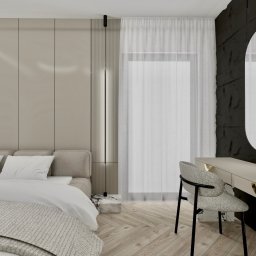 Inspiration Studio - Nowoczesna sypialnia z łóżkiem, toaletką z owalnym lustrem i krzesłem na tle ściany z dekoracyjną fakturą. Jasne kolory, drewniana podłoga w jodełkę.