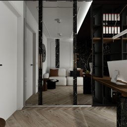 Inspiration Studio - Eleganckie biuro domowe z marmurowymi akcentami: czarne marmurowe ściany, drewniane biurko, biała sofa i szklane drzwi przesuwne. Nowoczesny design z dbałością o detale.