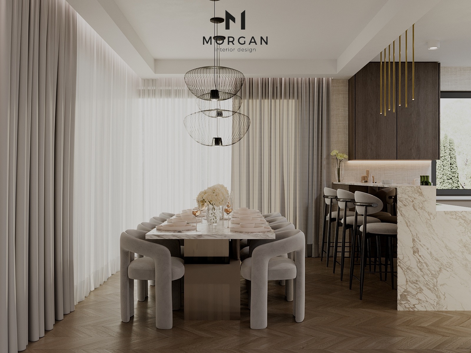 Nowoczesna jadalnia z marmurowym stołem i szarymi krzesłami na tle jasnych zasłon. Nad stołem wiszą designerskie lampy. Widoczny fragment blatu kuchennego z barkiem.