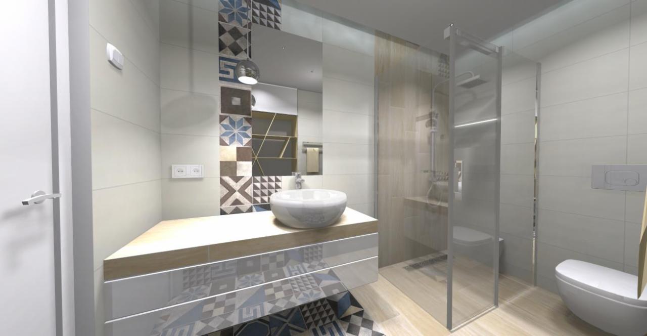 Wizualizacja łazienki z umywalką nablatową, kabiną prysznicową typu walk-in i toaletą wiszącą, wzorzyste płytki na ścianie i podłodze, oświetlenie punktowe.