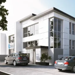 Wizualizacja nowoczesnego budynku usługowego z białymi panelami elewacyjnymi, dużymi oknami i dwoma zaparkowanymi samochodami; kobieta idzie chodnikiem, a mężczyzna rozmawia przez telefon obok auta.