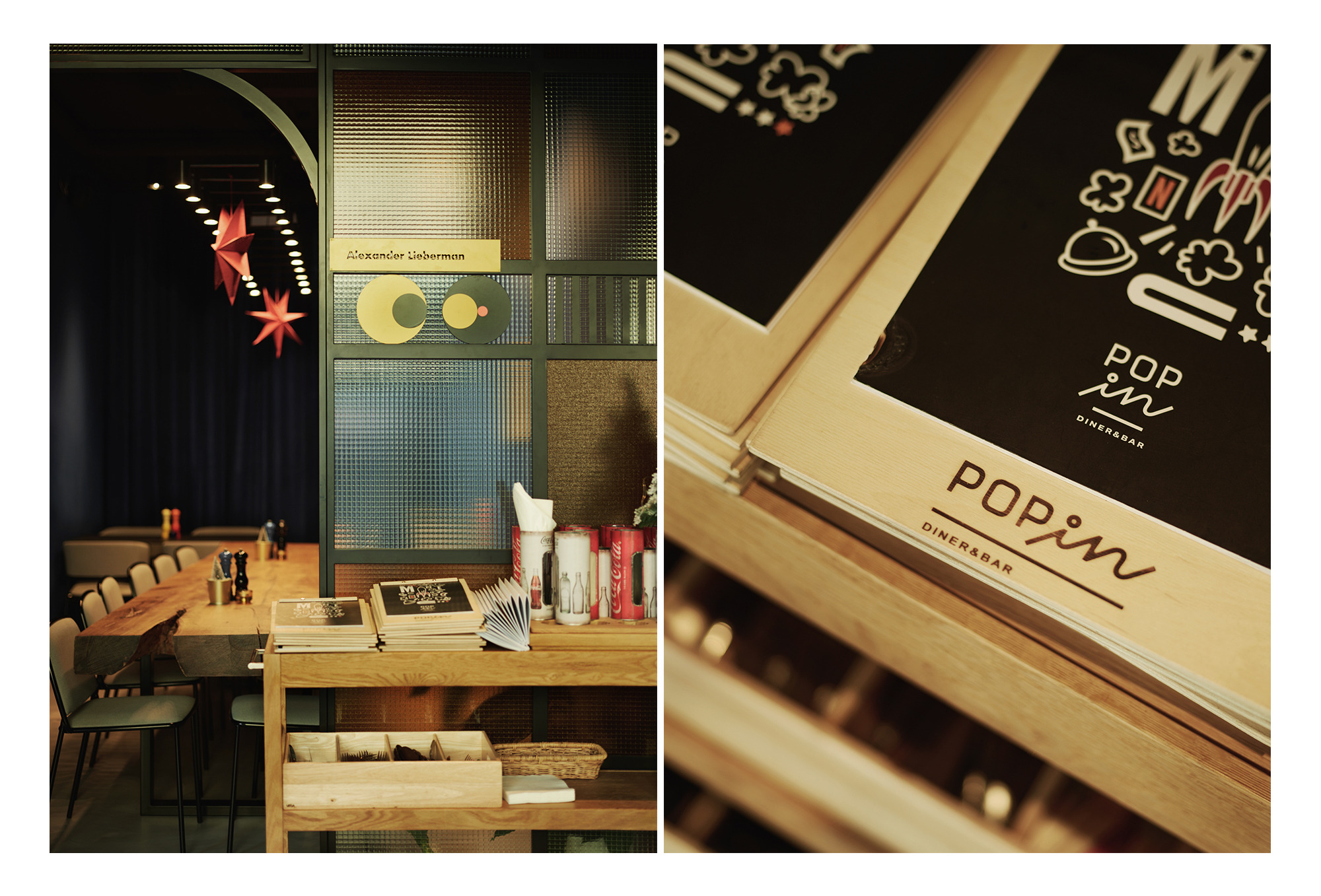 Wnętrze restauracji Pop-Inn Gdynia: długa drewniana ława z krzesłami, szklana ścianka działowa z geometrycznymi dekoracjami, półka z menu i akcesoriami.