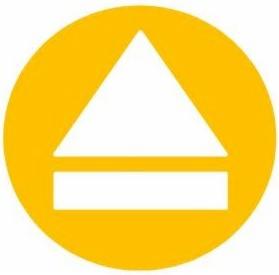 Żółte koło z białym symbolem: trójkąt skierowany w górę nad prostokątem. Symbolizuje kierunek wyjścia ewakuacyjnego.