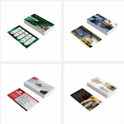 Zestaw ośmiu par wizytówek firmowych o różnej stylistyce i kolorystyce, ułożonych na białym tle pod kątem, prezentujących dane kontaktowe i logo firm z różnych branż.