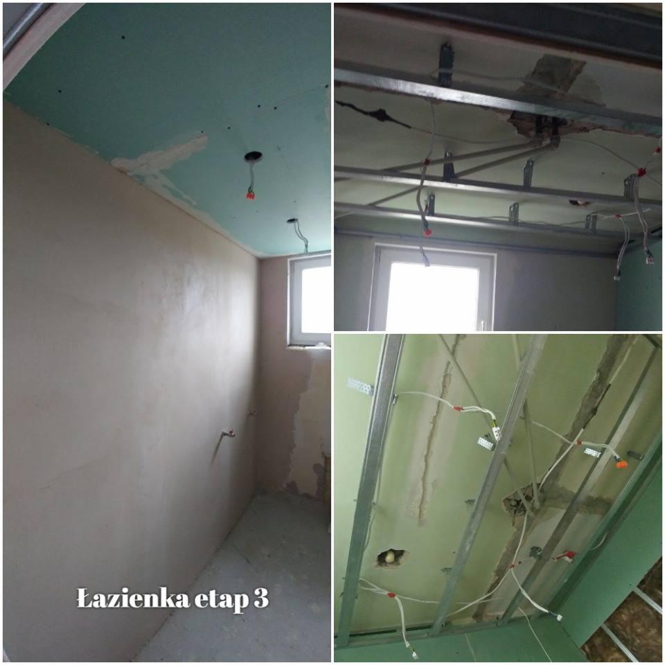Łazienka w trakcie remontu: ściany po wstępnym tynkowaniu, sufit z płyt kartonowo-gipsowych z widoczną konstrukcją metalową i wystającymi przewodami elektrycznymi.