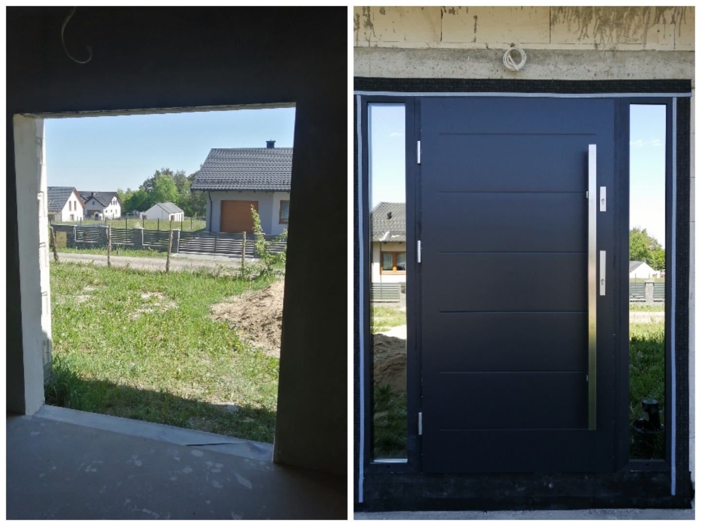 Czarne, nowoczesne drzwi wejściowe z długim, pionowym uchwytem i bocznymi przeszkleniami, widoczne z wnętrza budynku w stanie surowym, z widokiem na domy w tle.