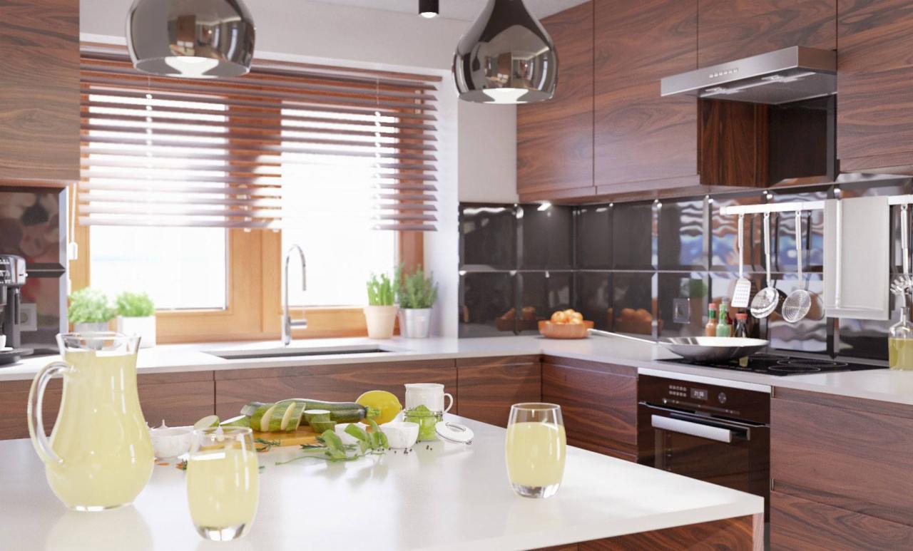 Nowoczesna kuchnia z drewnianymi szafkami, białym blatem, czarnymi płytkami na ścianie i srebrnymi lampami wiszącymi, z dzbankiem lemoniady i pokrojonymi warzywami na blacie.