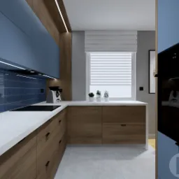 Wizualizacja kuchni z niebieskimi szafkami górnymi, pionową mozaiką na ścianie, drewnianymi szafkami dolnymi i białym blatem, oświetleniem LED pod szafkami i oknem z roletą rzymską.