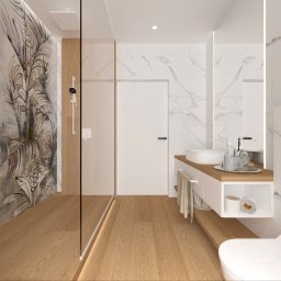 IMO studio - Nowoczesna łazienka z kabiną prysznicową oddzieloną szkłem, drewnianą podłogą i umywalką na szafce. Ściany wykończone marmurem i panelami z motywem roślinnym.