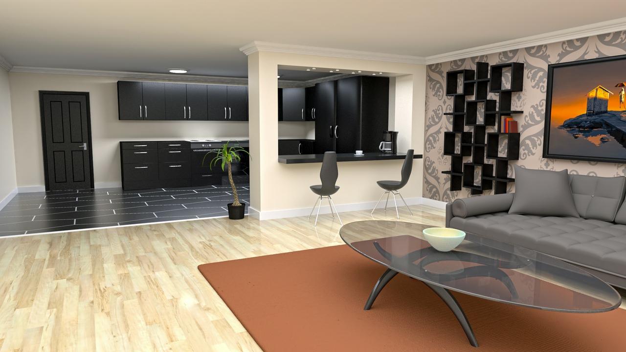 Nowoczesne wnętrze mieszkania z otwartą kuchnią, czarnymi meblami kuchennymi, szarą sofą, designerskimi krzesłami barowymi i geometryczną półką na ścianie z wzorzystą tapetą.