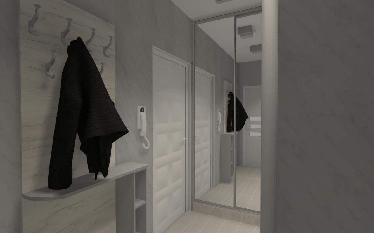 Wizualizacja przedpokoju w szarościach z minimalistycznym wieszakiem na ubrania, lustrzaną szafą przesuwną i białymi drzwiami z panelami.
