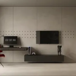 Nowoczesny pokój z biurkiem, czerwonym krzesłem, telewizorem, konsolą PlayStation 5 i dekoracyjnymi figurkami, wykończony w szarościach i czerniach z punktowym oświetleniem na ścianie.