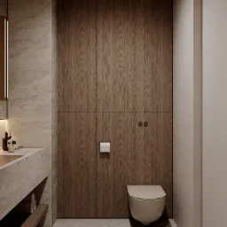 Minimalistyczna łazienka z drewnianą zabudową, umywalką z kamienia i podwieszaną toaletą. Ciepłe, stonowane barwy i proste linie tworzą elegancki wystrój.
