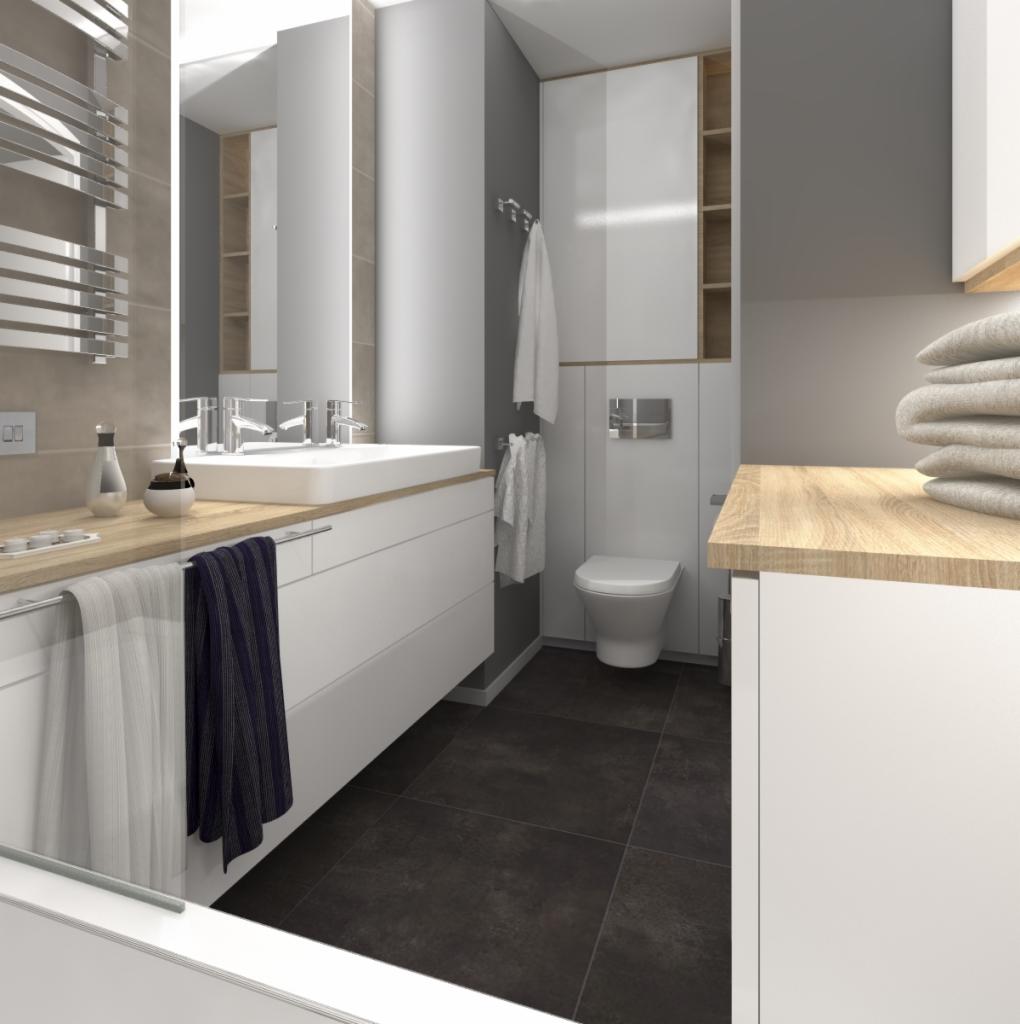 Nowoczesna łazienka z białymi szafkami pod umywalką, drewnianym blatem, ciemną podłogą z płytek i grzejnikiem drabinkowym na ścianie. Widoczny fragment wanny i toaleta w zabudowie.