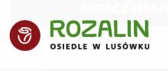 Logo firmy deweloperskiej 'Rozalin' z symbolem róży w czerwonym okręgu i zielonym napisem 'ROZALIN OSIEDLE W LUSÓWKU'.