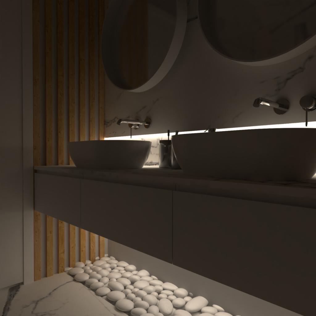 Nowoczesna łazienka z dwoma okrągłymi umywalkami nablatowymi, podświetleniem LED, marmurowym blatem i dekoracyjnymi białymi kamieniami na podłodze.