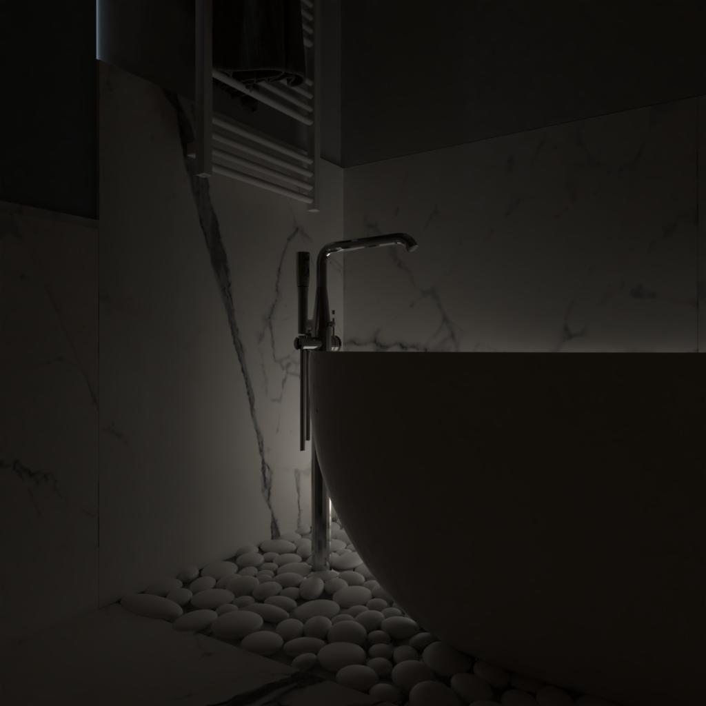 Minimalistyczna łazienka z wolnostojącą wanną, chromowaną baterią podłogową i białymi kamieniami dekoracyjnymi u podstawy wanny, oświetlenie LED za wanną, marmurowe płytki na ścianie z wyraźnym...