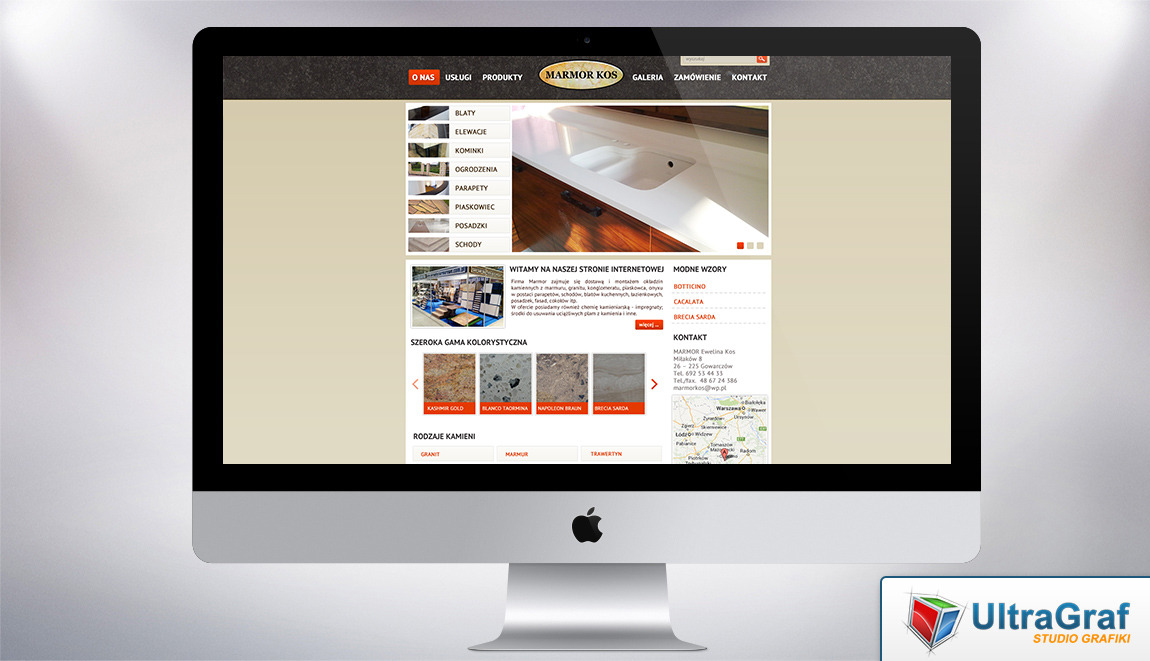 Ekran komputera iMac wyświetlający stronę internetową firmy Marmor Kos z ofertą blatów, elewacji, kominków i innych wyrobów z kamienia naturalnego, widoczne menu i zdjęcia realizacji.