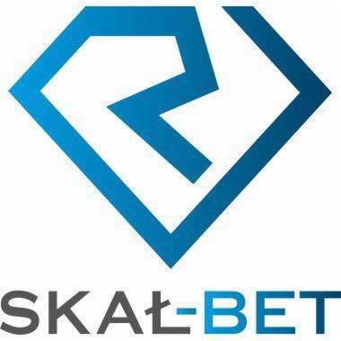 Niebieski logotyp firmy Skał-Bet w kształcie rombu z abstrakcyjnym motywem wewnątrz, nazwa firmy poniżej w kolorze szaro-niebieskim.