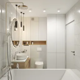 Nowoczesna łazienka z wanną, umywalką nablatową, podświetlanym lustrem i deszczownicą, utrzymana w jasnej kolorystyce z akcentami drewna.