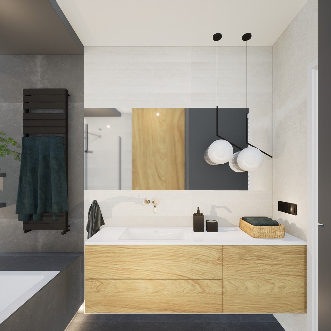 Nowoczesna łazienka z drewnianą szafką pod umywalką, wiszącymi lampami i dużym lustrem. Minimalistyczny design z akcentami drewna i szarości.