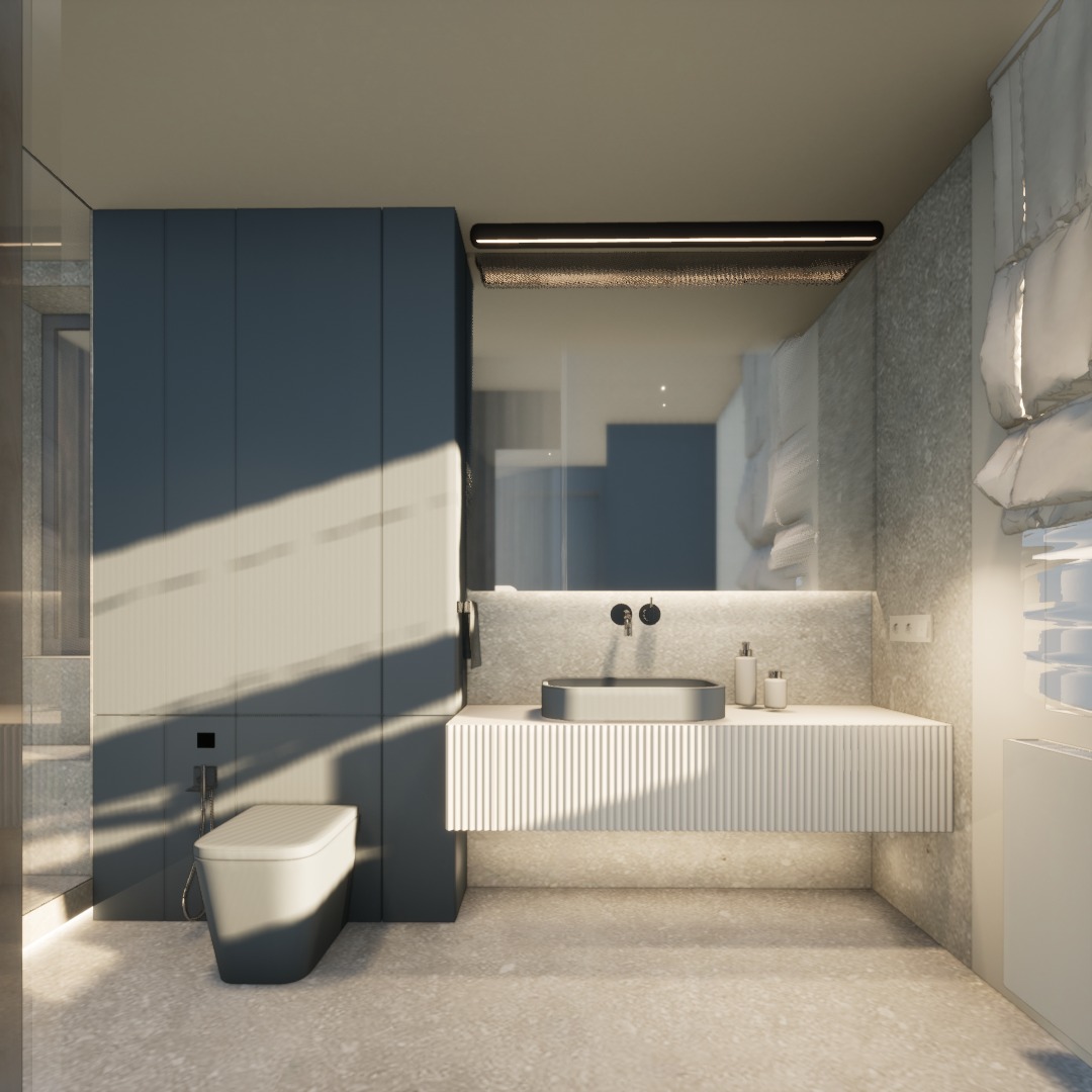 Nowoczesna łazienka z szarą umywalką, białą szafką z lamelami i toaletą w odcieniach szarości. Na ścianie widoczne geometryczne wzory i oświetlenie nad lustrem.