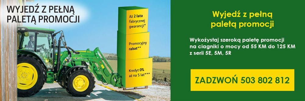 Grafika reklamowa ciągnika John Deere z promocją: do 2 lat fabrycznej gwarancji, promocyjny rabat, kredyt 0% aż na 5 lat. Na pierwszym planie zielony ciągnik z żółtymi kołami.