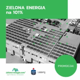 Widok z góry na dach budynku w Zielonej Górze, pokryty panelami słonecznymi, z parkingiem pełnym samochodów w tle. Grafika z hasłem 'ZIELONA ENERGIA na 101%' i logo firmy.