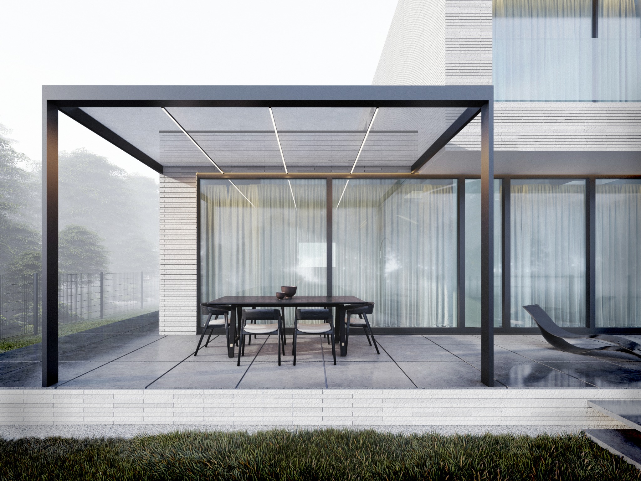Nowoczesny taras z pergolą i minimalistycznym zestawem mebli ogrodowych na tle białej, ceglanej elewacji domu w mglisty dzień.