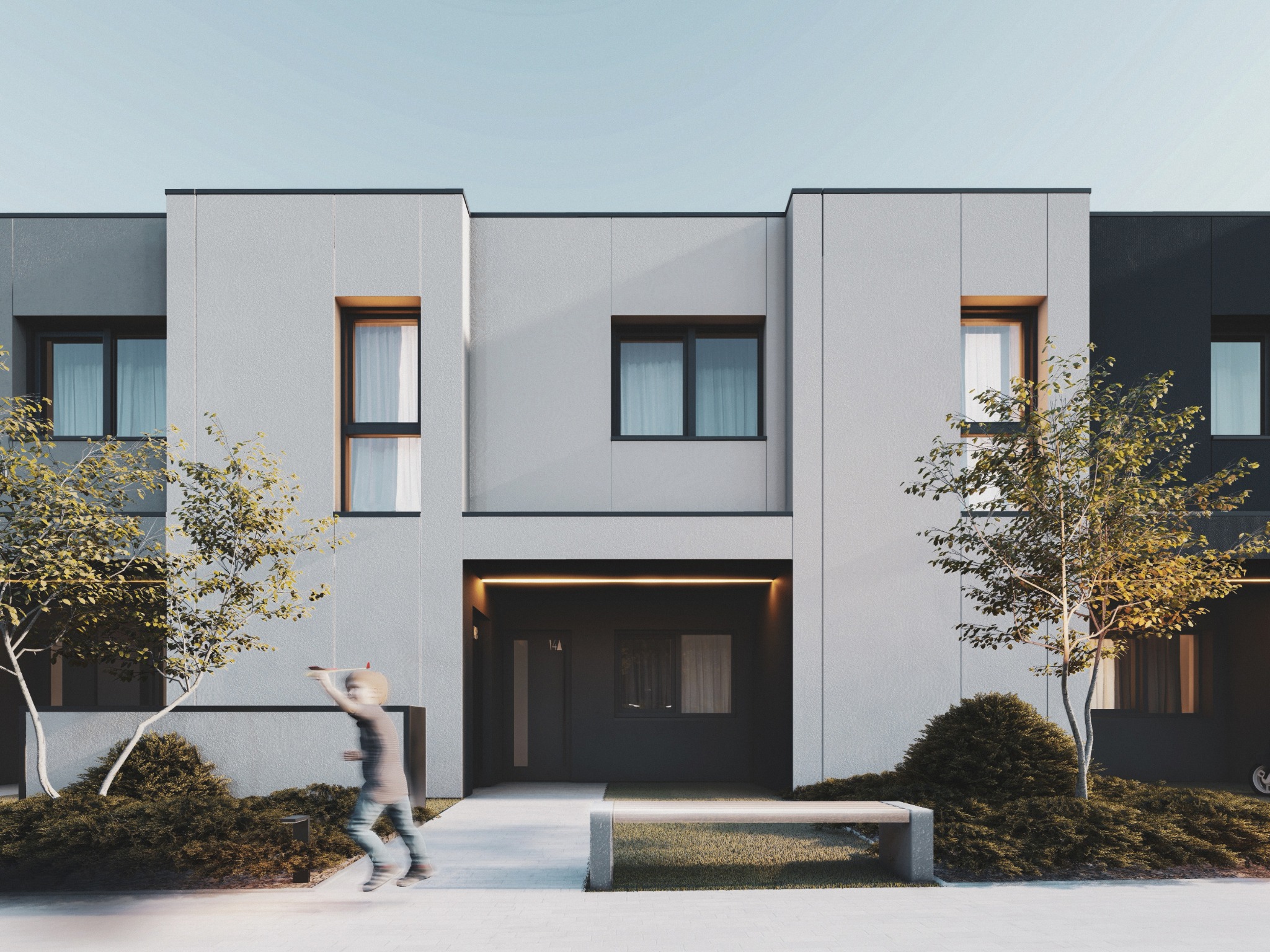 Nowoczesny dom dwukondygnacyjny z szarą elewacją i płaskim dachem, z dzieckiem bawiącym się na podjeździe. Minimalistyczny ogród z ławką i młodymi drzewami.