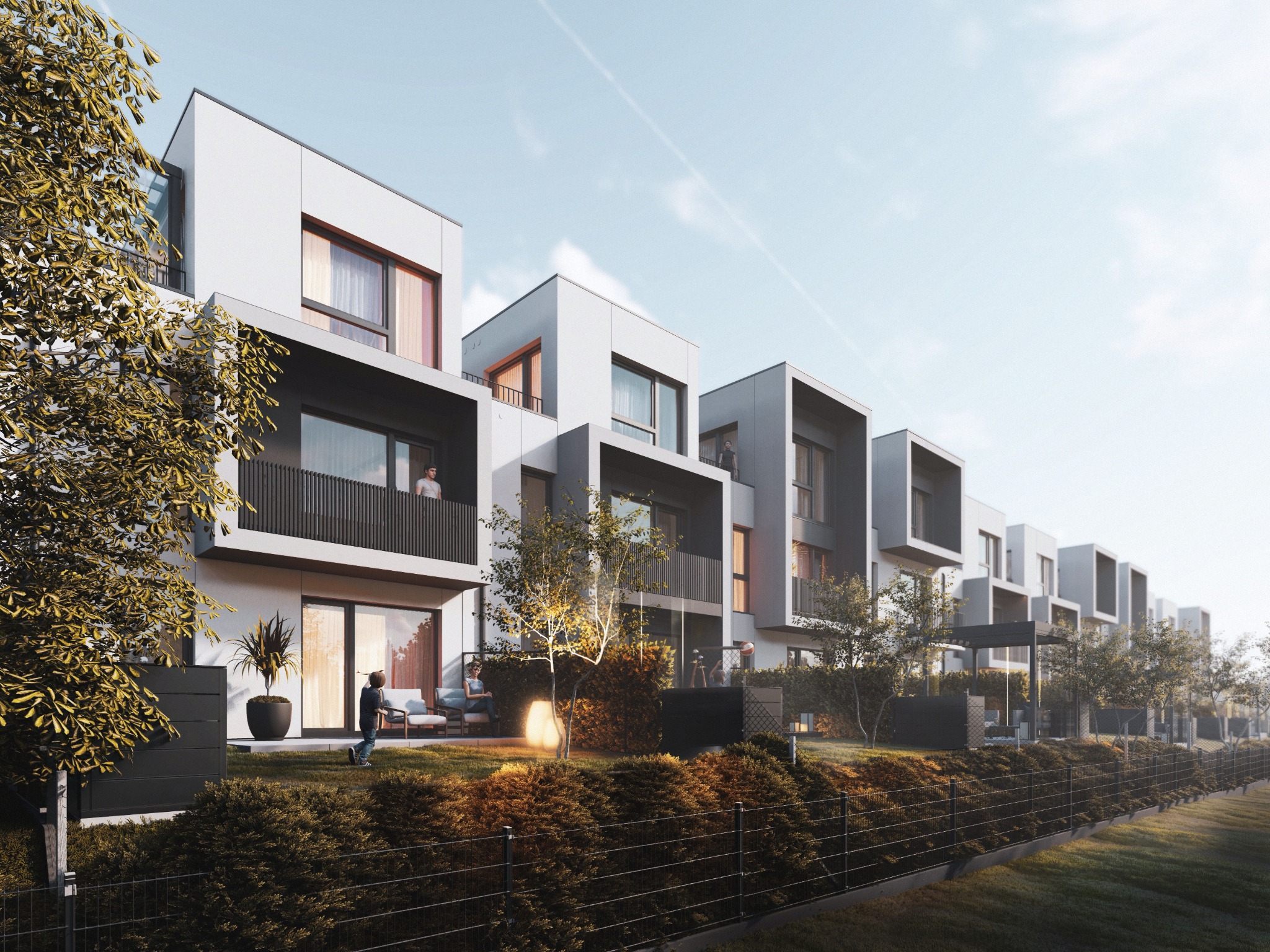 Wizualizacja szeregu nowoczesnych domów z płaskimi dachami, z balkonami i ogrodami, oświetlonych ciepłym światłem, z widocznymi postaciami ludzi na balkonach i w ogrodzie.