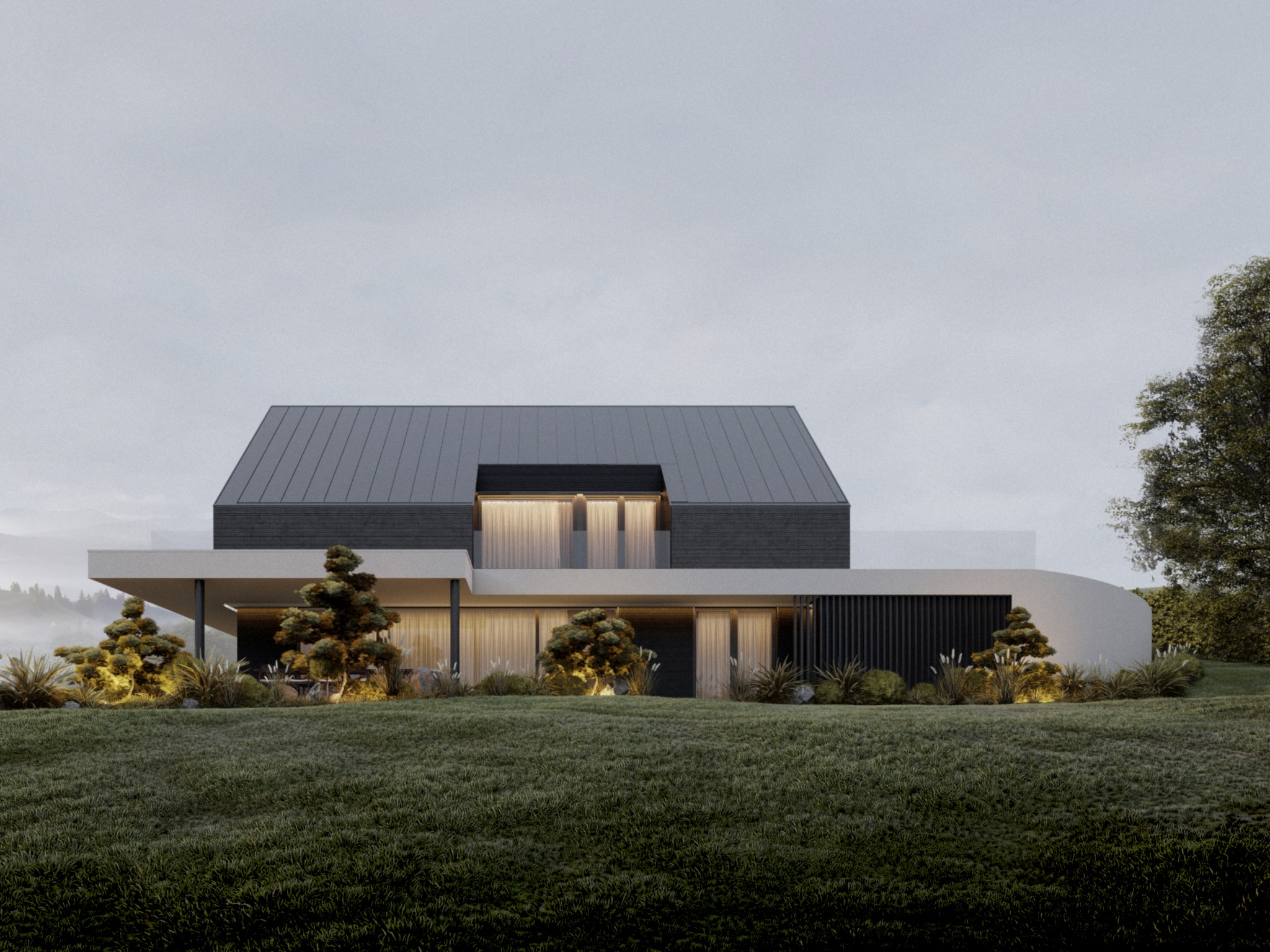 Nowoczesny dom z ciemnym dachem i jasną elewacją, otoczony zielonym trawnikiem i ozdobnymi krzewami. Widoczne delikatne oświetlenie elewacji i subtelna mgła w tle.