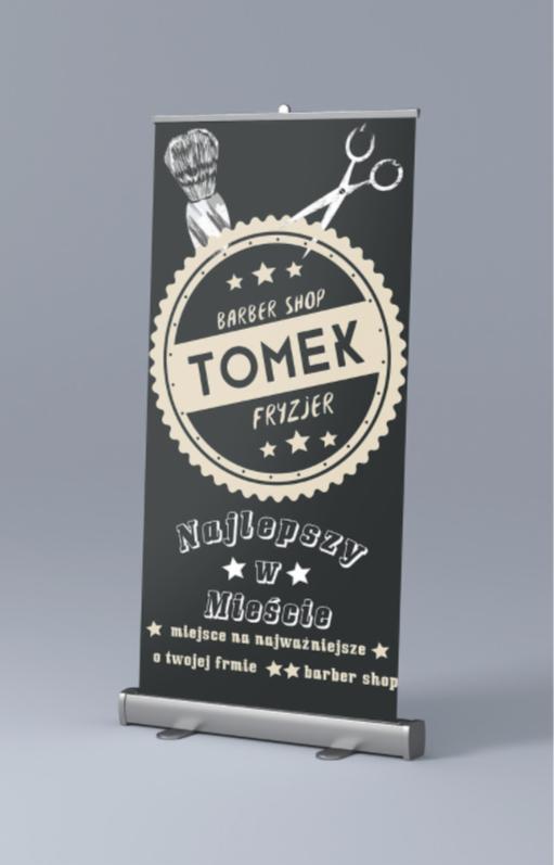 Rozwijany baner reklamowy dla barber shopu Tomex Fryzjer z grafiką pędzla do golenia i nożyczek na czarnym tle.