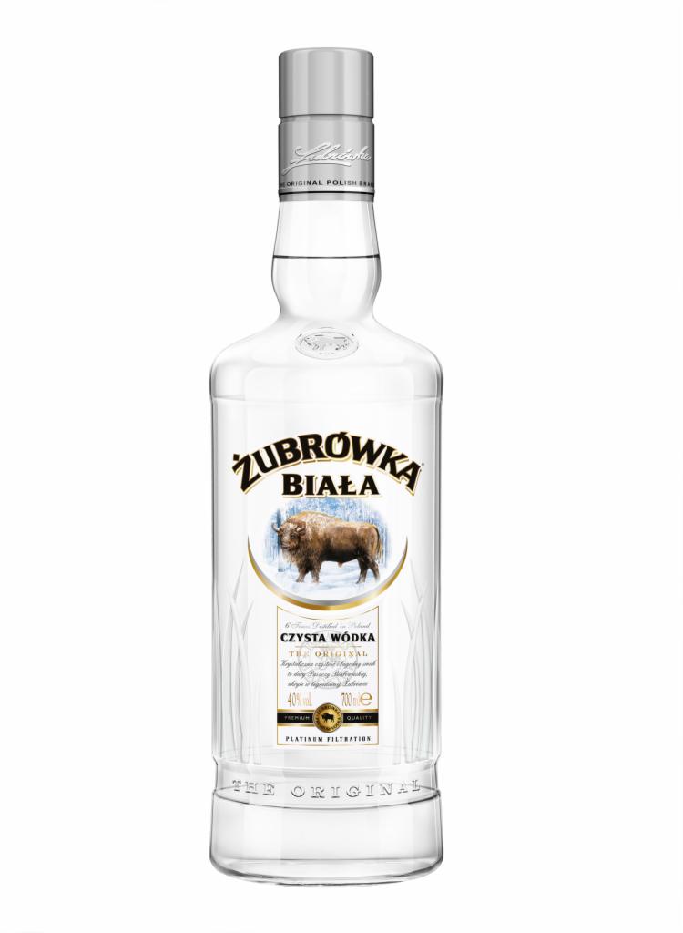 Butelka czystej wódki z etykietą Żubrówka Biała, na której widnieje wizerunek żubra na tle zimowego krajobrazu.