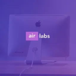 Monitor iMac z logiem Apple i nakładką graficzną 'air labs' na fioletowym tle.