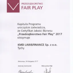 Certyfikat Jakości Biznesu 'Przedsiębiorstwo Fair Play' 2017 dla KMD LAW&FINANCE Sp. z o.o. z Tychów, podpisany przez Andrzeja Arendarskiego i Mieczysława Bąka.