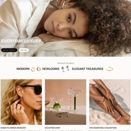 tinyDOM - Strona internetowa sklepu jubilerskiego z modelką i ofertą biżuterii: kolczyki, pierścionki, bransoletki. Minimalistyczny design, eleganckie zdjęcia produktowe, hasło 'Everyday Luxury'.