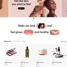 tinyDOM - E-commerce strona z produktami do pielęgnacji skóry: paleta cieni, serum, kremy. Promocyjny baner z uśmiechniętymi modelkami i hasłem 'Get the skin you want to feel'.
