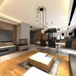 Nowoczesny salon z drewnianą podłogą, szarą sofą i ścianą z telewizorem, oświetlony wiszącymi lampami i listwami LED.